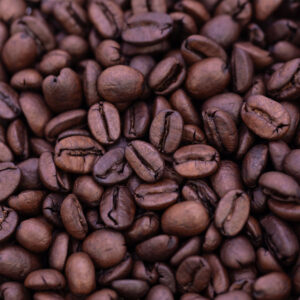 Close-up view of Wailuku Coffee Company's decaf espresso coffee beans for sale on Maui.