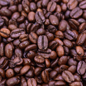 Close-up view of Wailuku Coffee Company's shiny espresso coffee beans for sale on Maui.