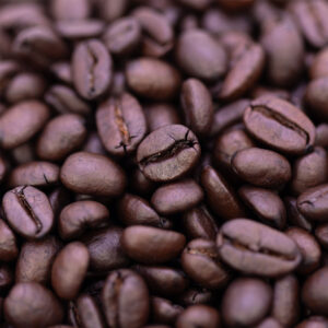 Close-up view of Wailuku Coffee Company's French Roast coffee beans for sale on Maui.