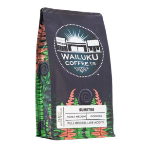 A bag of Sumatra coffee with a fern design on it and a white background.