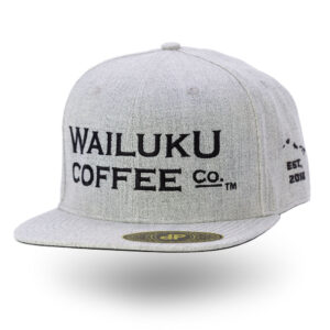 The grey snapback hat features a front view of the Wailuku Coffee Co logo embroidered in black.
